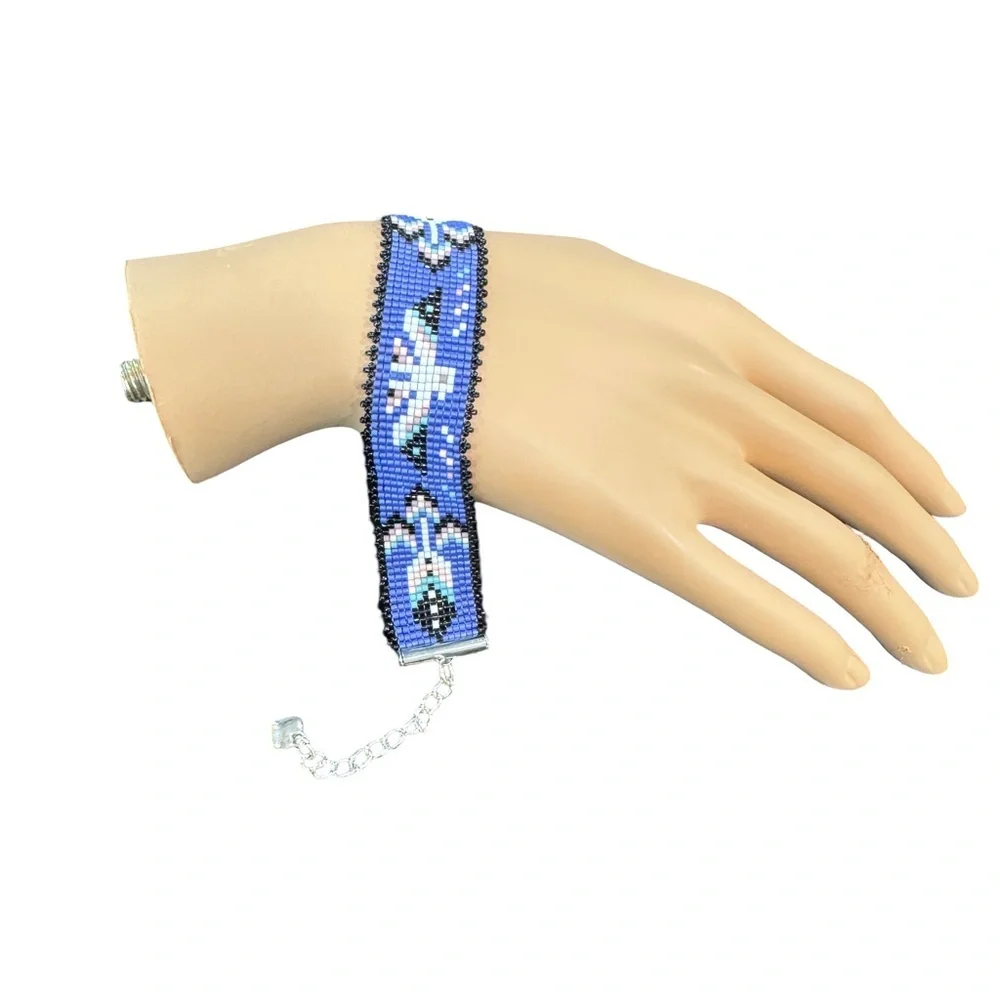 Hand crafted Adjustable Beaded Bracelet with Thunderbird and charms